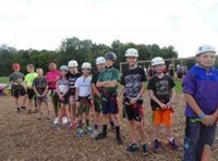 Kids wearing helmets outside