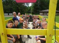Students and teachers riding on a tractor trailer